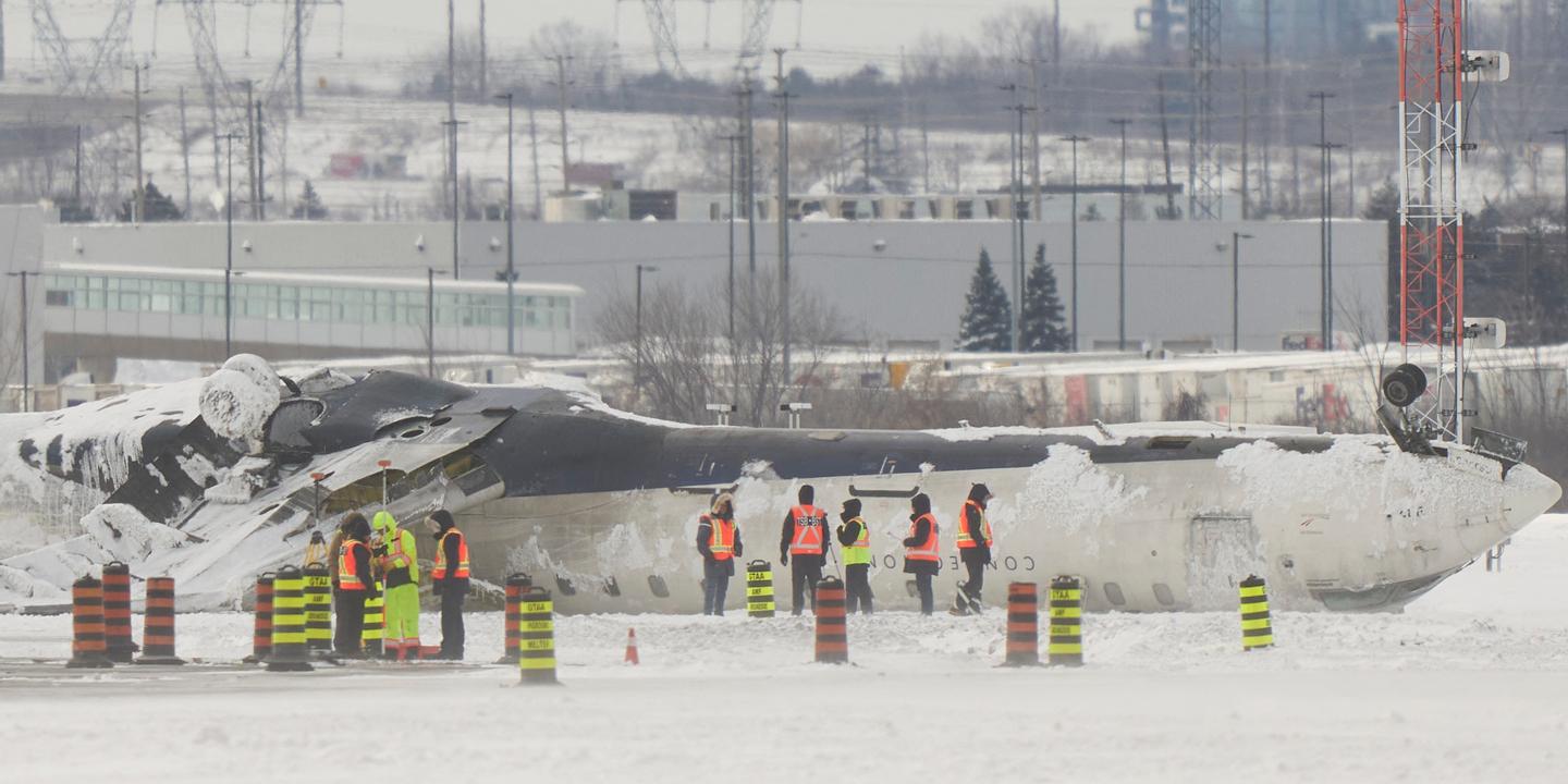 Delta Air Lines, Toronto Pearson Airport, CRJ900, Bombardier, Accident, Fire, Injuries, Investigation, Transportation Safety Board of Canada, Weather Conditions
