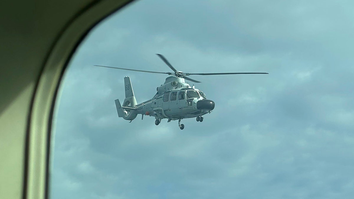 South China Sea, Philippines, China, Scarborough Shoal, Territorial standoff, Philippine patrol plane, Chinese navy helicopter, Tense standoff, UNCLOS, United States, Western countries, Defense alliances