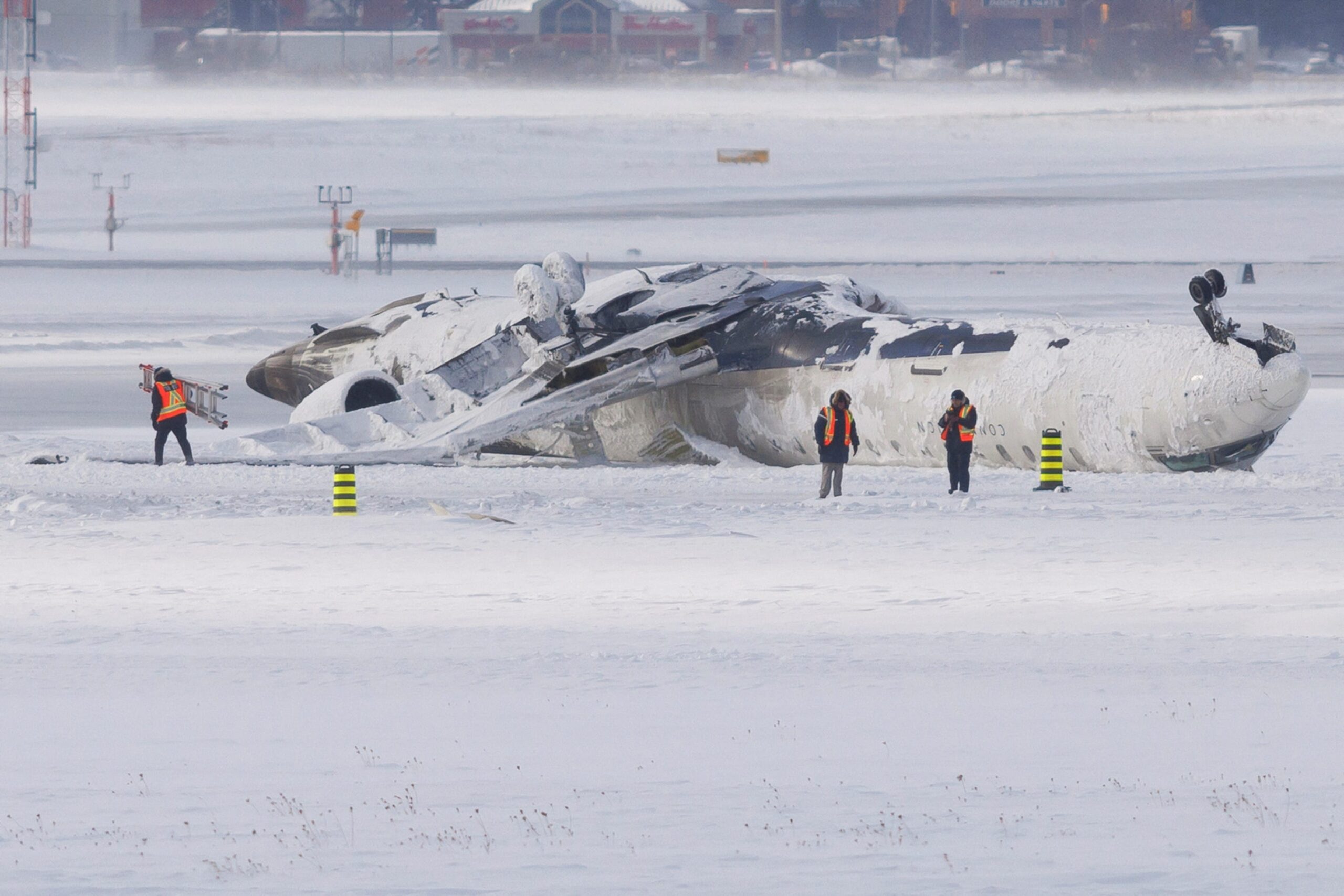 Toronto Pearson Airport crash, Delta Air Lines compensation, Bombardier CRJ900 crash, Endeavor Air, Transportation Safety Board of Canada, U.S. National Transportation Safety Board