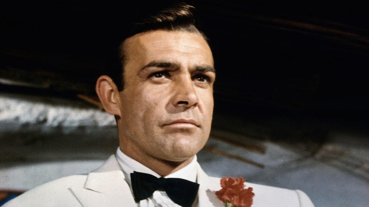 James Bond, Amazon, Valerie Leon, Daniel Craig, Henry Cavill, American writers, American producers, American actor, British franchise, race, gay, woman, Ian Fleming Publications, King Charles III, American-style wokeness