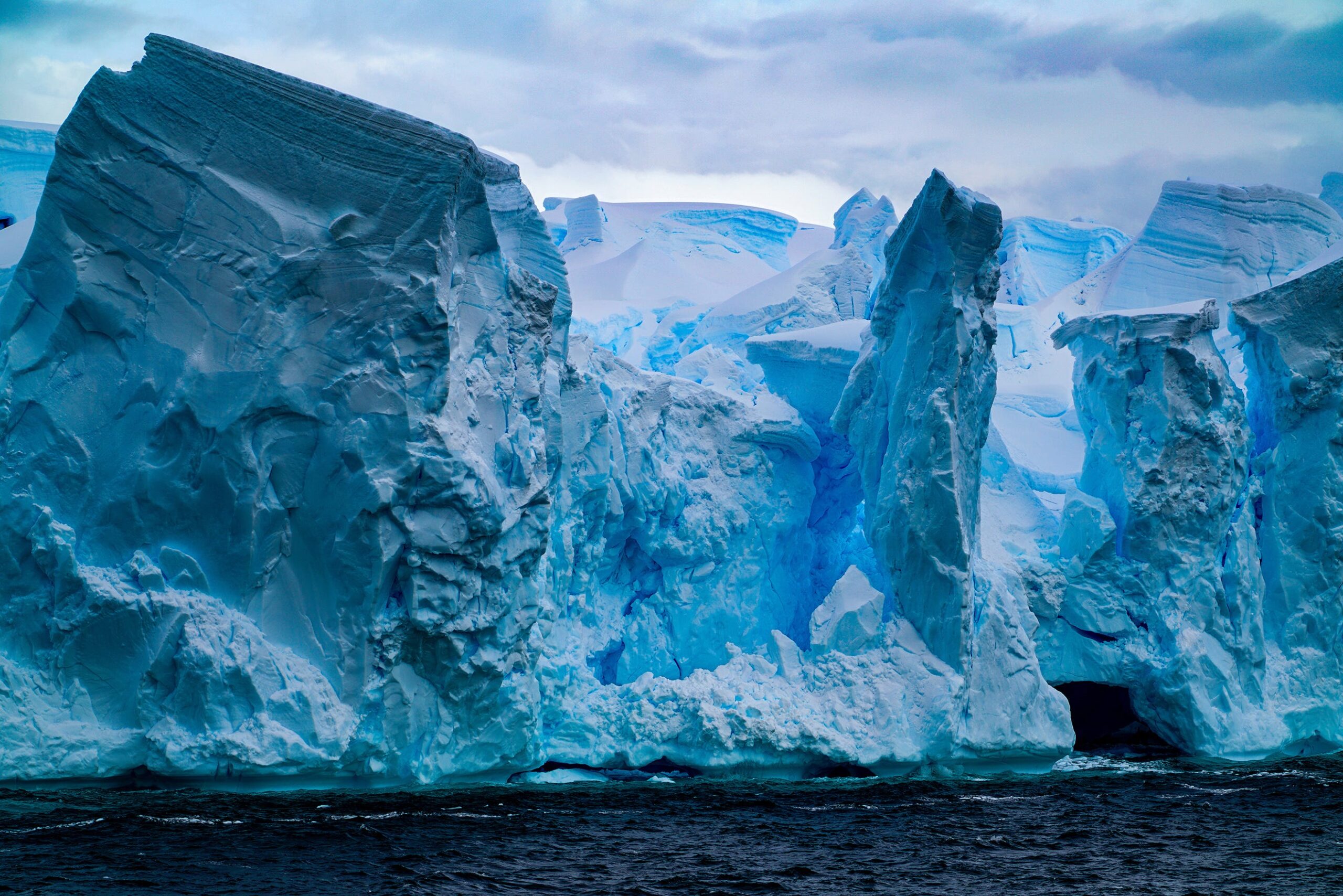 Cryogenian period, glaciers, Earth's crust, mineral release, ocean chemistry, evolution of life, climate change, uranium, oxygen levels, geological transformations, complex life, ancient glaciers, sedimentary rocks, global glaciations, climate shifts, Timescales of Mineral Systems Group, Curtin University, University of Portsmouth, St. Francis Xavier University
