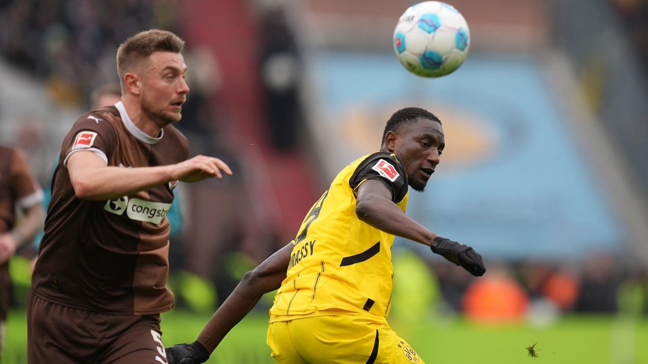 Borussia Dortmund, BVB, FC St. Pauli, Fußball-Bundesliga, Champions League, Serhou Guirassy, Karim Adeyemi, Niko Kovac, Alexander Blessin, Europapokal-Plätze, Fußball, Sport, Spielbericht, Analyse, Millerntor-Stadion, Noah Weißhaupt, Philipp Treu, Pascal Groß, Elias Saad, Jackson Irvine, Hauke Wahl
