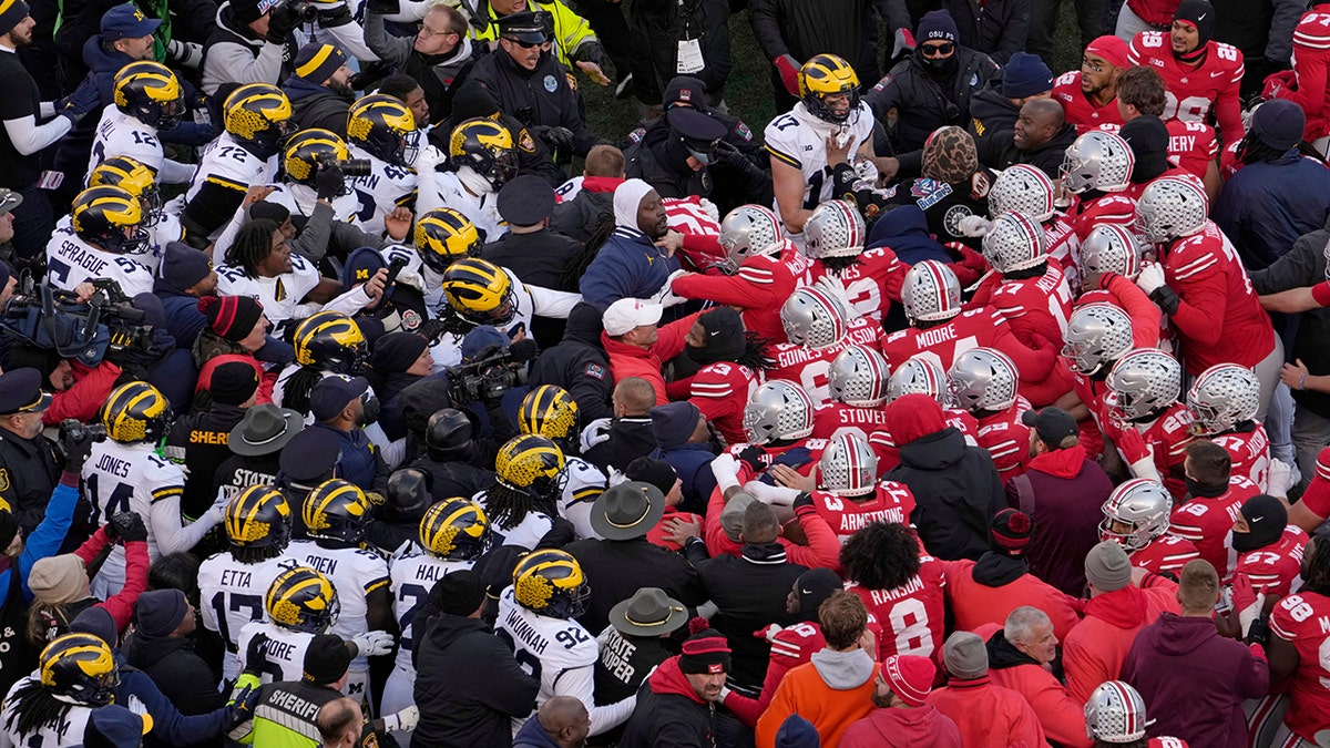 Michigan, Ohio State, Rivalry Week, football brawl, pepper spray, Ohio Stadium, Ryan Day, Sherrone Moore, Kalel Mullins, college football, sports, national champions, fines, Wolverines, Buckeyes
