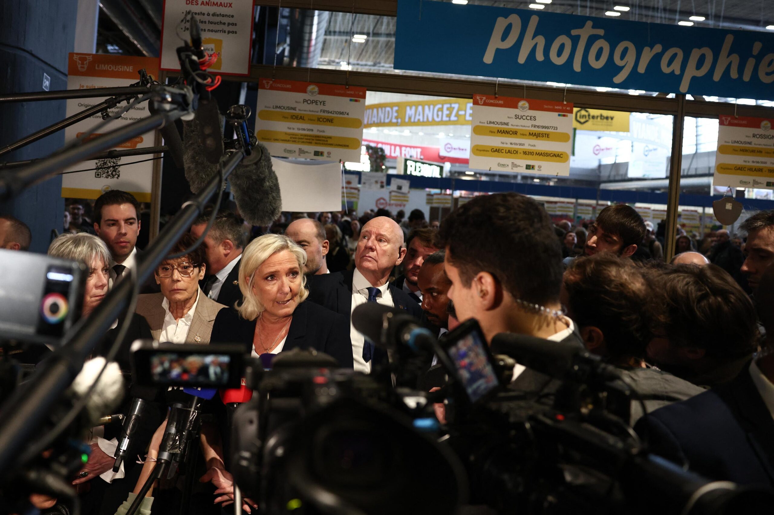 Marine Le Pen, Donald Trump, Volodymyr Zelensky, France, United States, Russia, Ukraine, agriculture fair, national interests, diplomacy, peace, conflict, European Union, RN (National Rally), international relations, political incident
