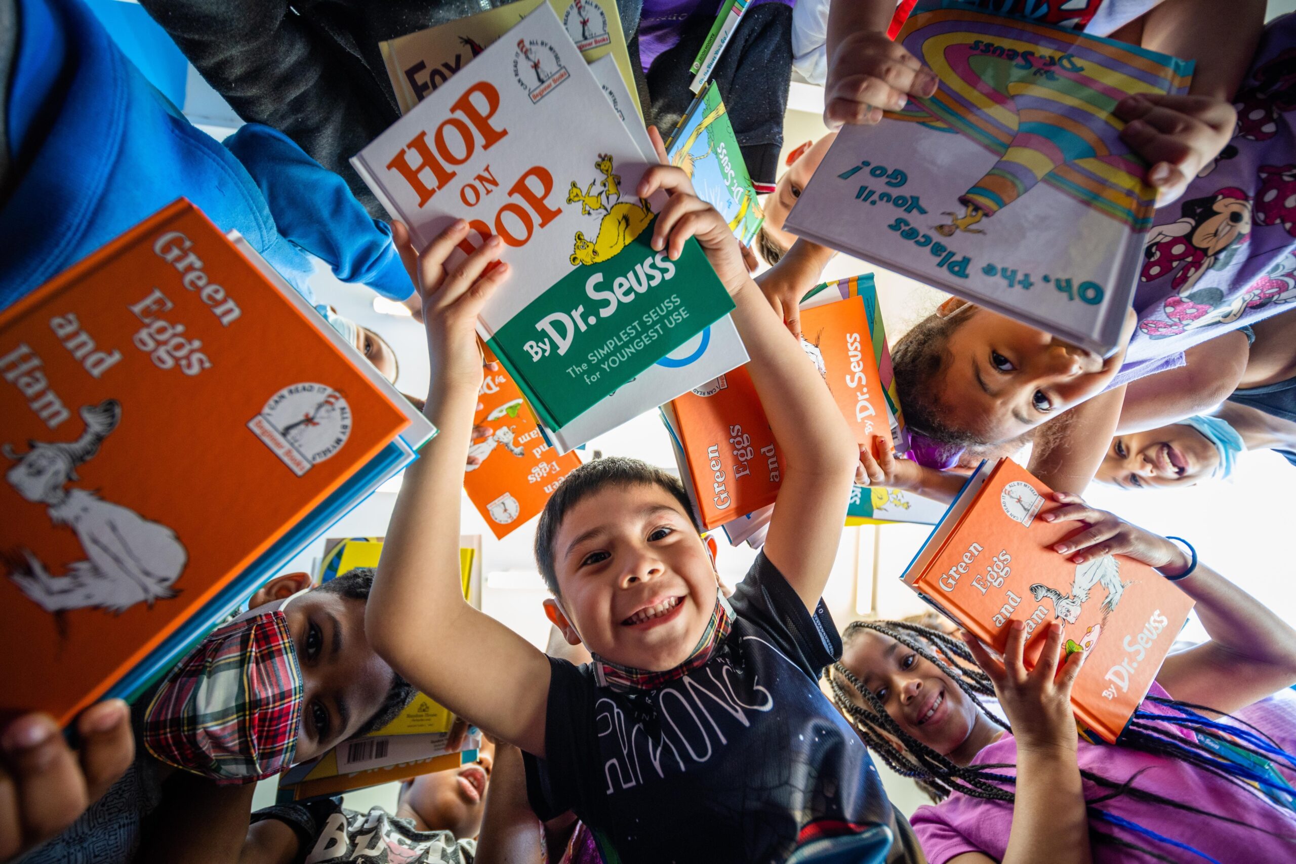 Dr. Seuss Day, The Cat in the Hat, free book, Dr. Seuss Enterprises, March 2 birthday, Read Across America, children's books, Theodor Seuss Geisel, book donation, First Book, underserved communities, Tackle Reading, NFL players, Random House Children's Books, Susan Brandt, Clare Mulroy, books reporter, USA TODAY, books newsletter

