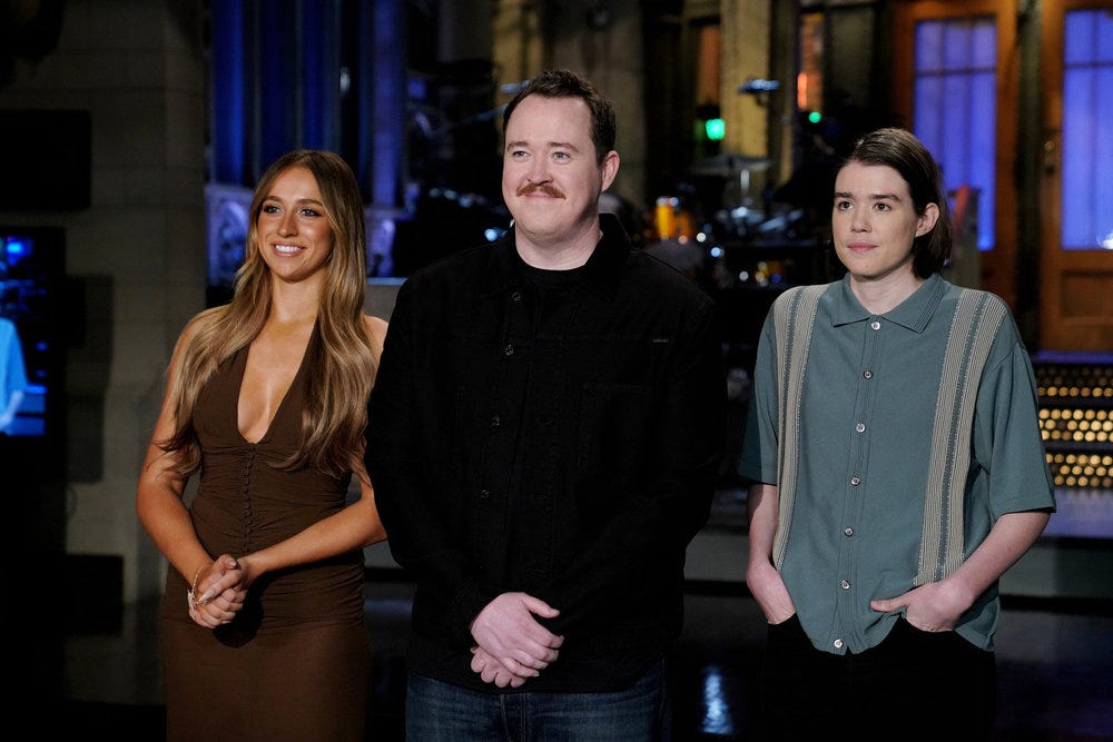 Saturday Night Live, SNL, Donald Trump, Volodymyr Zelenskyy, James Austin Johnson, Bowen Yang, Mikey Day, Marcello Hernández, Marco Rubio, JD Vance, Elon Musk, Mike Myers, Shane Gillis, cold open, comedy, political satire, sketch comedy, DOGE, Department of Government Efficiency, mass firings, controversy, offensive jokes, backlash, social media, Real Housewives of Potomac, Andy Cohen, Cosby, Ken Burns, historical documentaries
