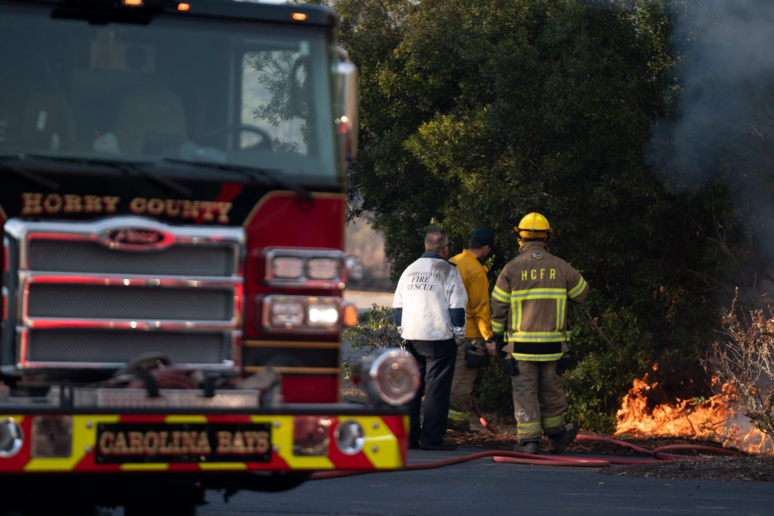 Firefighters, Carolinas, wildfires, Covington Lane Fire, Carolina Forest, Horry County, Polk County, evacuation, emergency shelters, wind-fueled brush fires, South Carolina, North Carolina, fire containment, National Weather Service, southern Plains, fire weather, Texas, Arizona, New Mexico, Kansas, wind gusts, fire risk.
