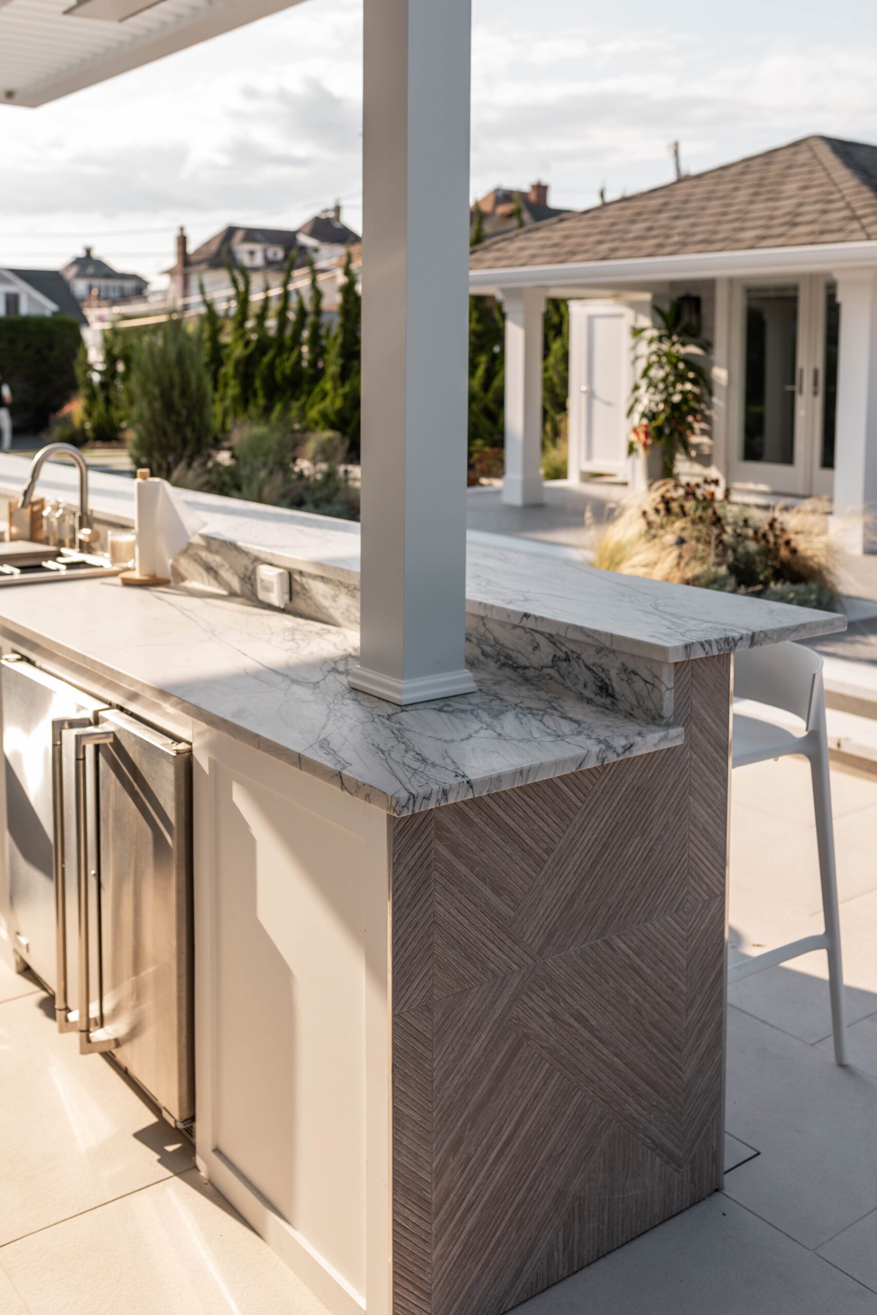 outdoor kitchen, outdoor kitchen design, outdoor kitchen ideas, outdoor kitchen cost, outdoor kitchen budget, outdoor kitchen materials, outdoor kitchen appliances, outdoor kitchen contractor, outdoor kitchen designer, outdoor living space, backyard renovation, home improvement, Quartzite countertops, marine-grade appliances, pergola, outdoor heaters, outdoor fans, New Jersey Shore, coastal design, patio design
