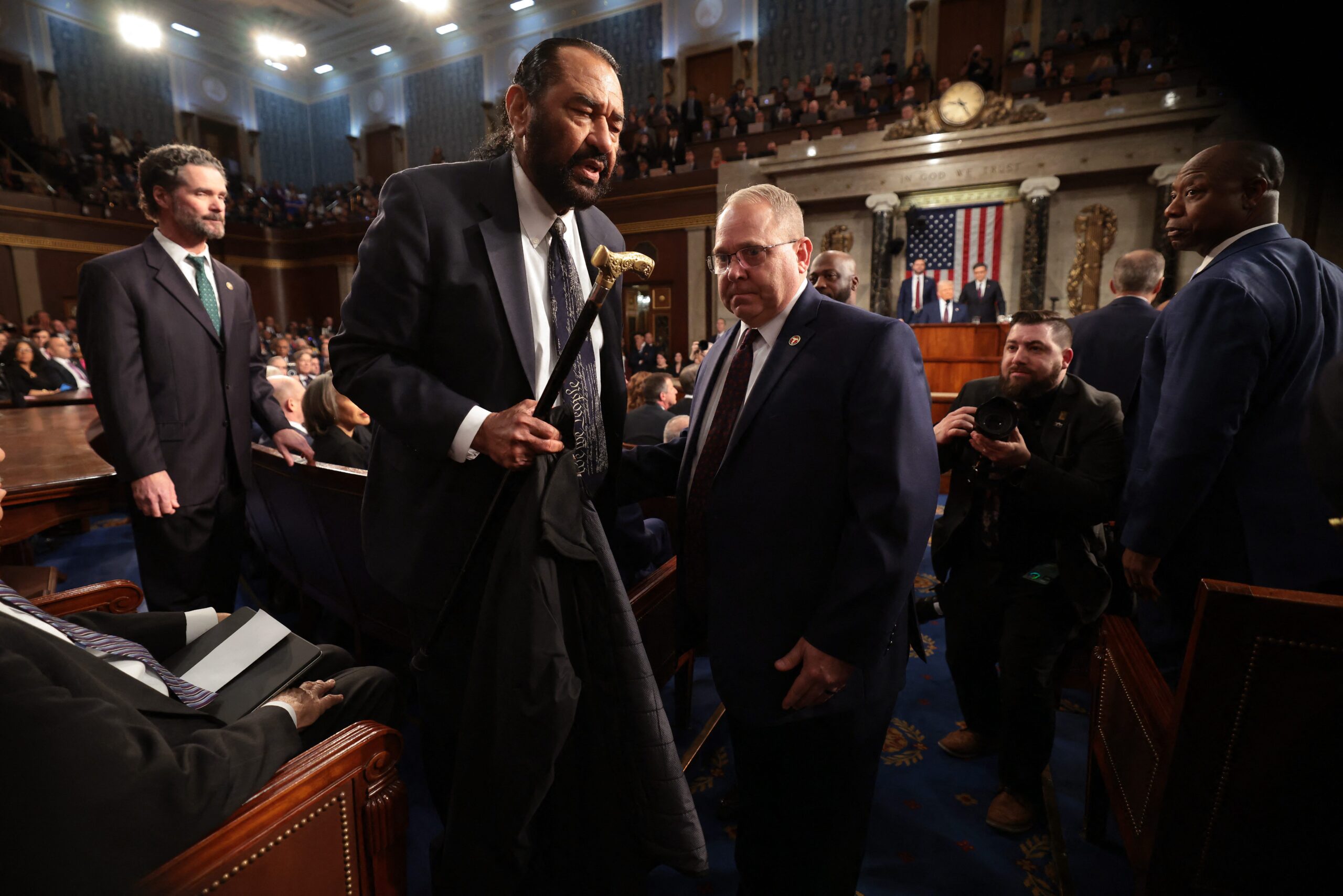 Al Green, Donald Trump, U.S. Capitol, joint congressional address, interruption, Mike Johnson, House Speaker, removal, Texas Democrat, no mandate, Medicaid, articles of impeachment, Ukraine, Russia, Marjorie Taylor Greene, Make America Great Again hat, Save Medicaid, Musk Steals, Protect Veterans, House rules, political protest
