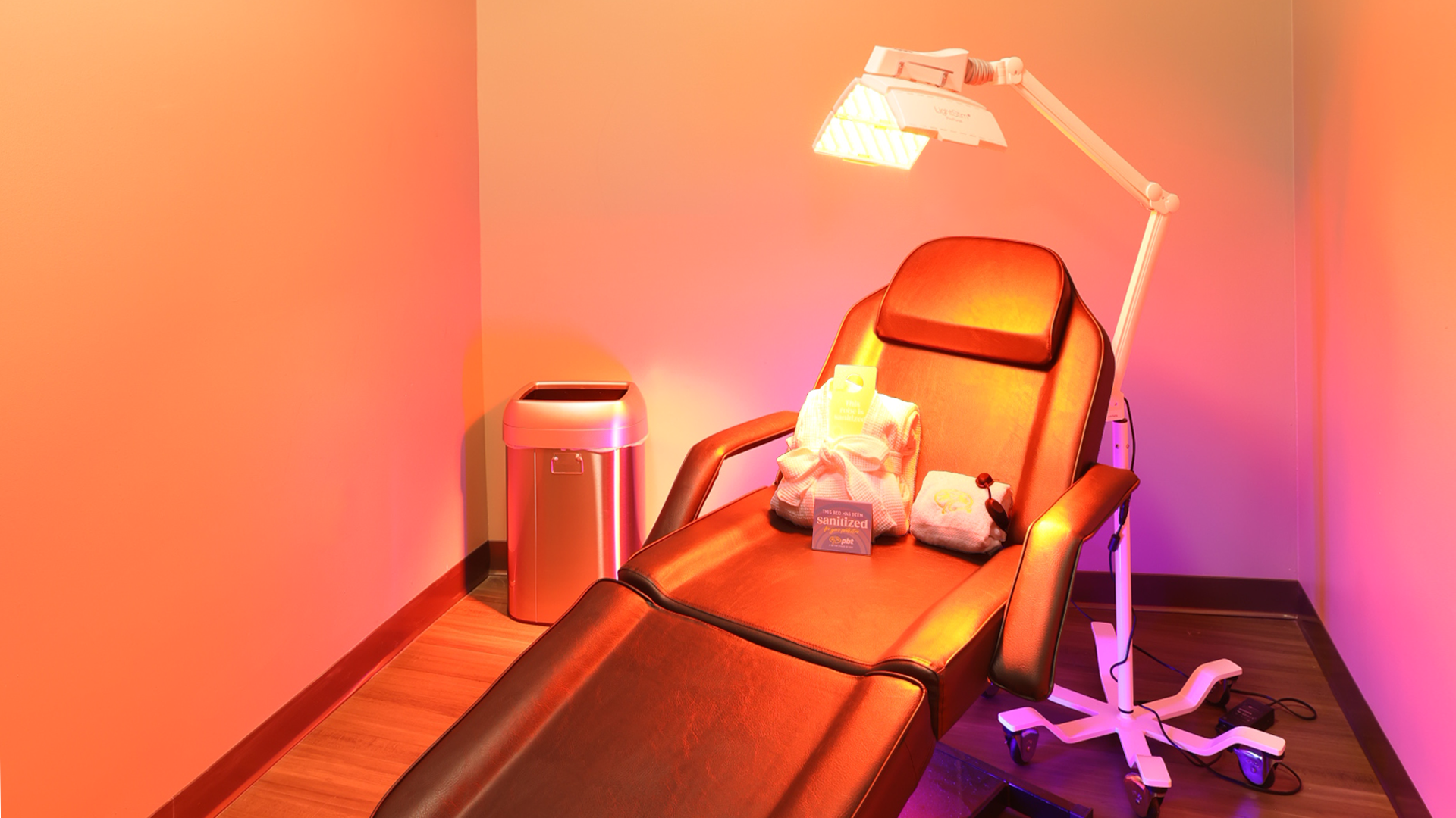 tanning salons, red light therapy, skin cancer, wellness industry, sun spas, tanning beds, UV rays, dermatology, skin health, beauty, infrared saunas, spray tans, sunless tanning, hyperpigmentation, rosacea, lupus, acne, wrinkles, anti-aging, consumer trends
