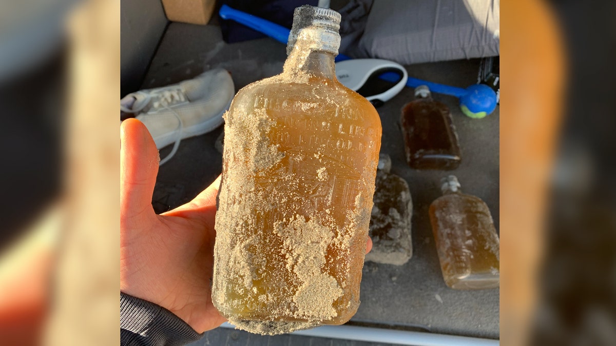 whiskey, Prohibition, New Jersey, beach, Lincoln Inn, Montreal distillery, Coast Guard, dog, Koda, bottle digging, vintage whiskey, rum running, bootleggers, history, mystery, collectibles, liquor, alcohol, treasure, rare find
