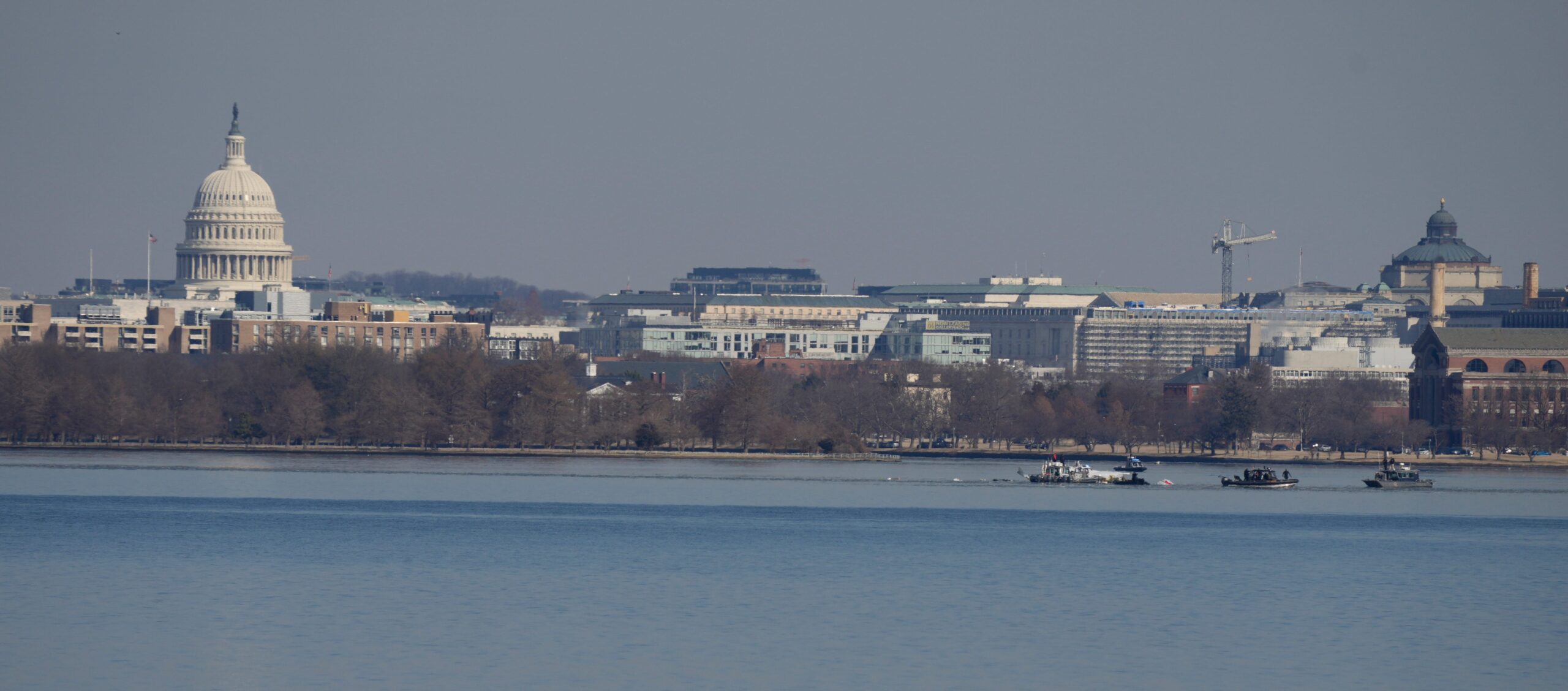 NTSB report, midair collision, American Airlines, regional jet, Army Black Hawk helicopter, Potomac River, Air Traffic Control, communications issue, DCA airspace, near-midair collision, NMAC, Traffic Alert and Collision Avoidance System, TCAS, Helicopter Route 1, altitude deviation, PSA Airlines, Runway 33, visual separation, radio interference, transponder, Federal Aviation Administration, FAA, helicopter routes, high-traffic airspace, flight data recorders, airspace management, Transportation Secretary Sean Duffy, safety recommendations, Ronald Reagan Washington National Airport, mixed helicopter and fixed-wing traffic, Airlines for America, military helicopters, approach paths, air traffic control procedures, mixed-use airspace, victims, accident, investigation, Washington D.C.
