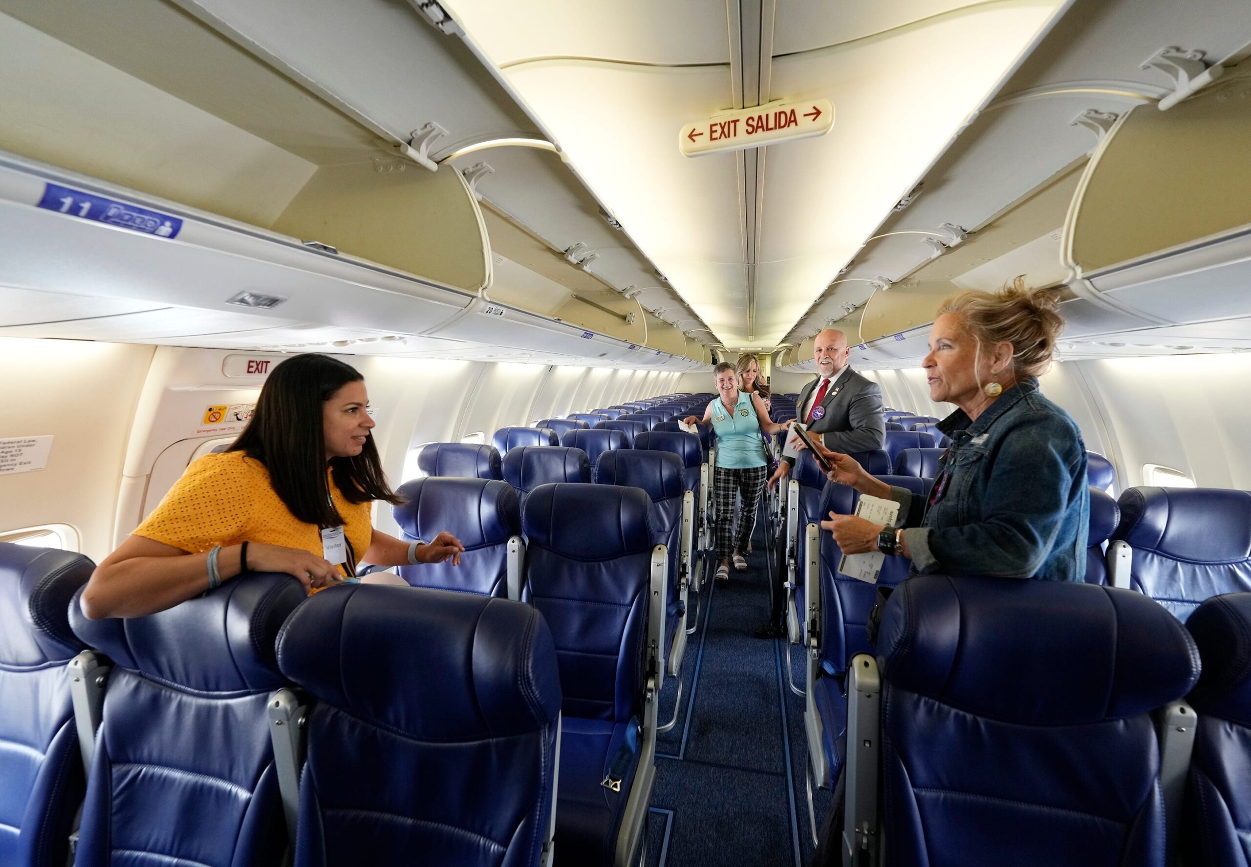 airplane etiquette, plane conversations, travel etiquette, Chelsea Handler, annoying travelers, in-flight behavior, seatmate etiquette, travel annoyances, Nick Leighton, 