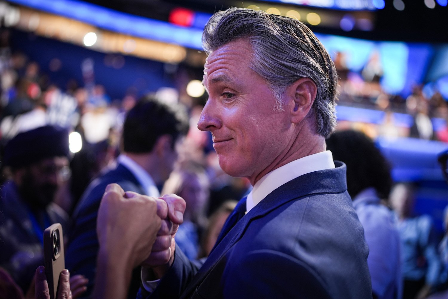 Gavin Newsom, California Governor, Tech Executives, Burner Phones, Political Strategy, Democratic Party, Presidential Run, Progressive Politics, Moderate Democrats, Bernie Sanders, Podcast, Right-Wing Figures, Charlie Kirk, Steve Bannon, Democratic Favorability, Jon Stewart, Economic Populism, Social Security, Medicaid, Corporate Profits, Reagan-era Republican
