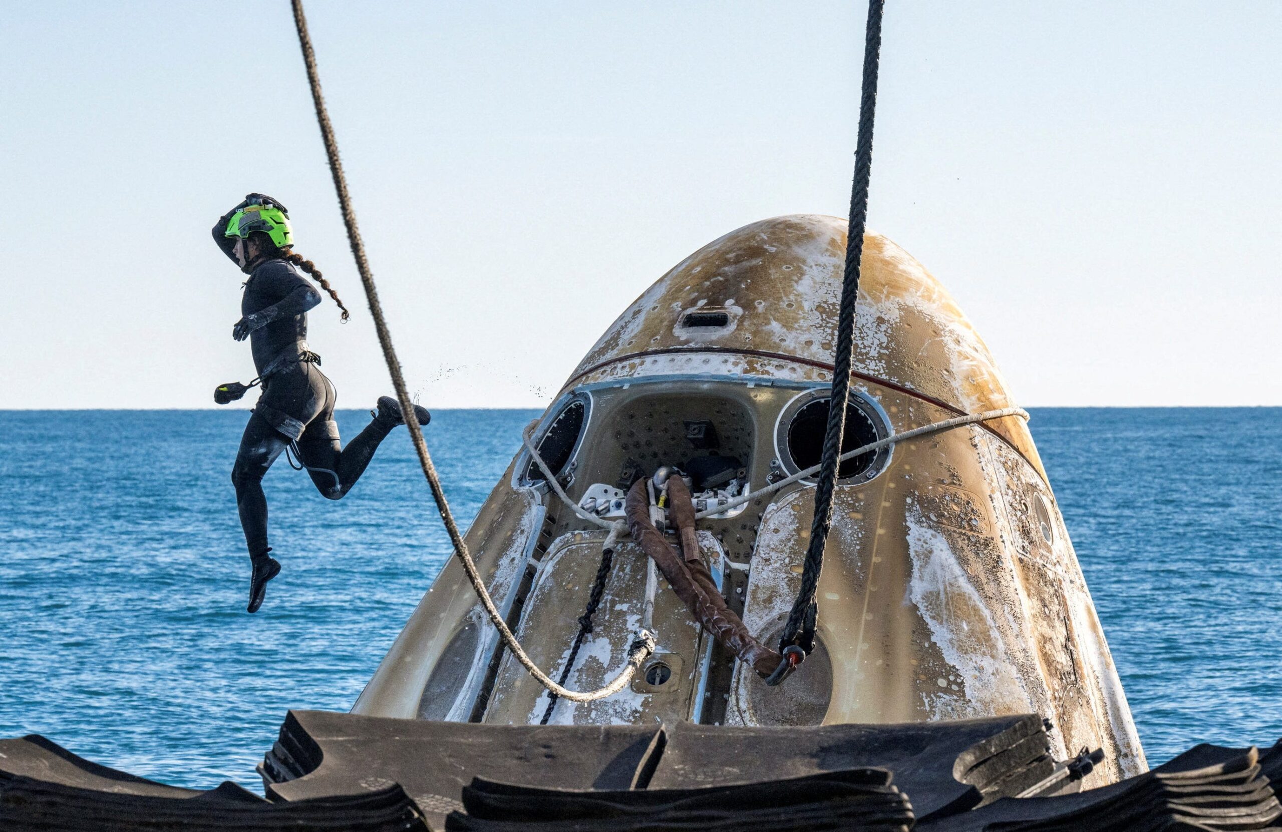 Butch Wilmore, Suni Williams, NASA, Boeing Starliner, SpaceX Dragon, Crew-9, Nick Hague, Aleksandr Gorbunov, International Space Station, spaceflight, splashdown, water landing, astronaut return, space mission, Eric Lagatta
