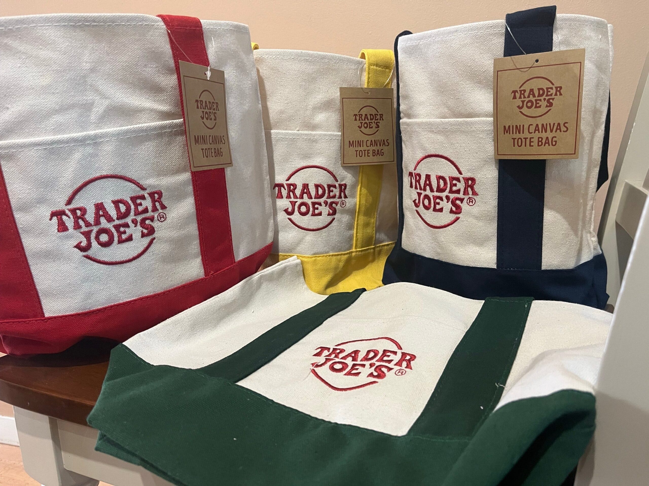 Trader Joe's, mini canvas tote bags, grocery store, limited edition, viral trend, reselling, April release, pastel colors, $2.99, product availability, shopping frenzy, TikTok, collectibles, shopping, news, Trader Joe's bags
