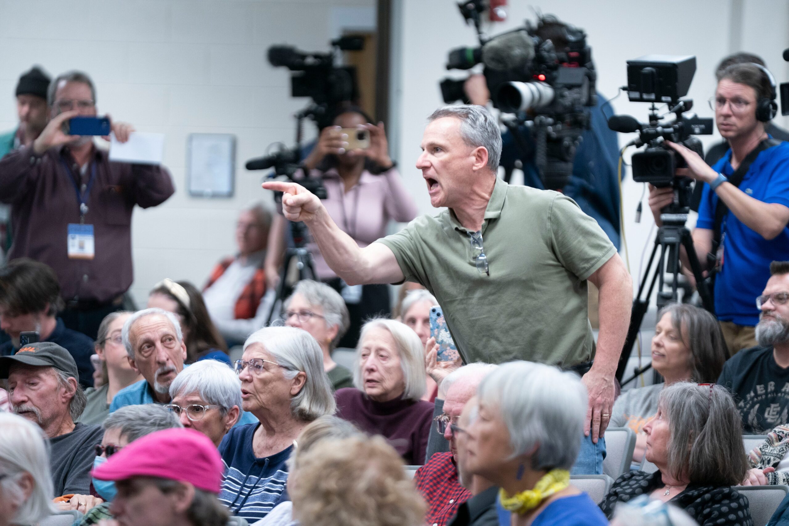 town hall meetings, Democratic lawmakers, Republican lawmakers, Donald Trump, executive power, government funding, Social Security, Elon Musk, Department of Government Efficiency (DOGE), Chuck Schumer, Michael Bennet, Glenn Ivey, Chuck Edwards, Mike Flood, Harriet Hageman, Ryan Zinke, Tim Walz, Derrick Van Orden, Veterans Affairs, Indivisible group, political activism, constituent concerns, government cuts, administrative state, midterm elections, political protests, political discourse
