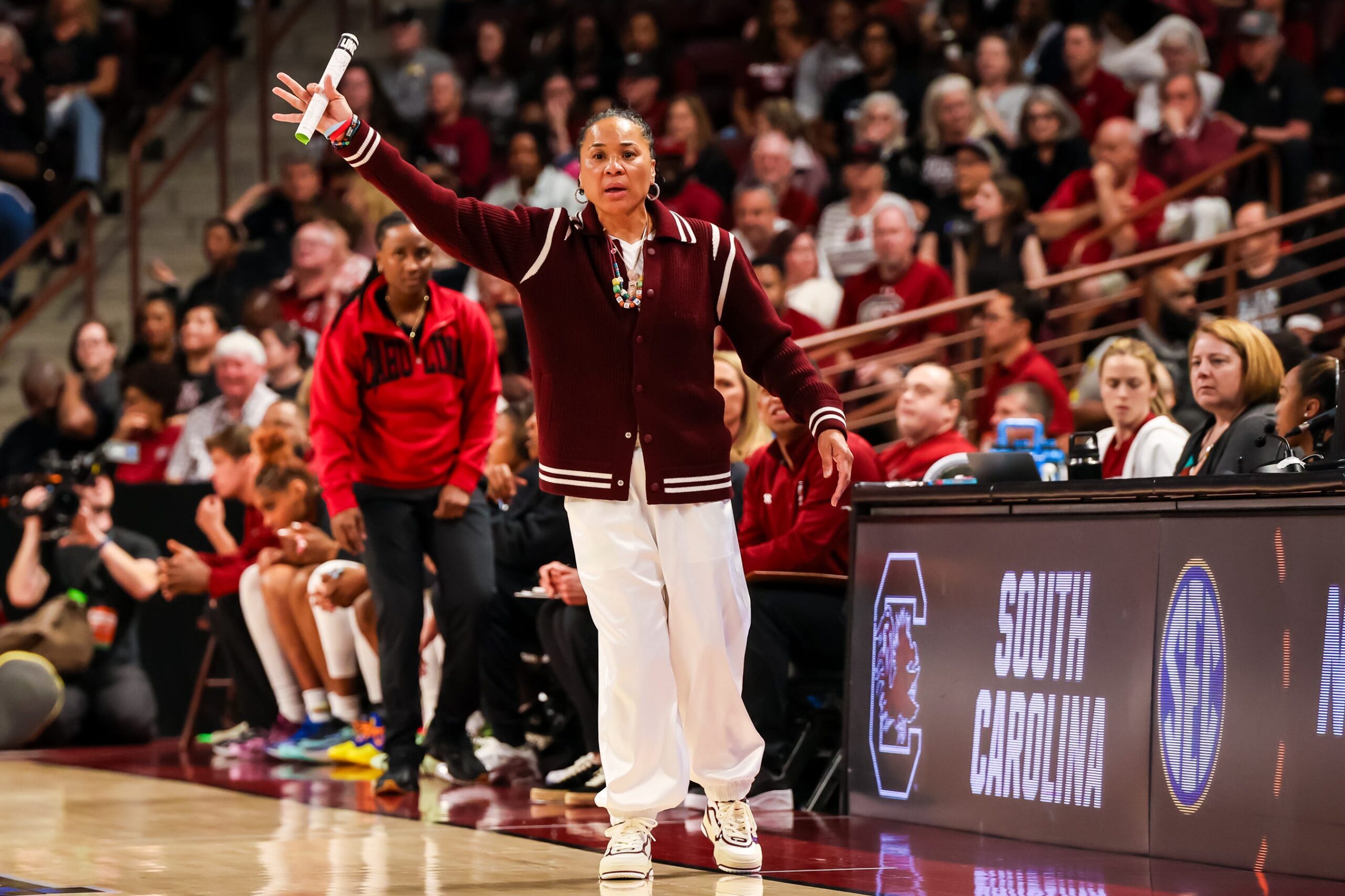 Plies, Dawn Staley, South Carolina Gamecocks, women's basketball, March Madness, NCAA Tournament, rapper, gift, gold chain, championship, Colonial Life Arena, Olivia Noni, sports media, Greensboro, concert
