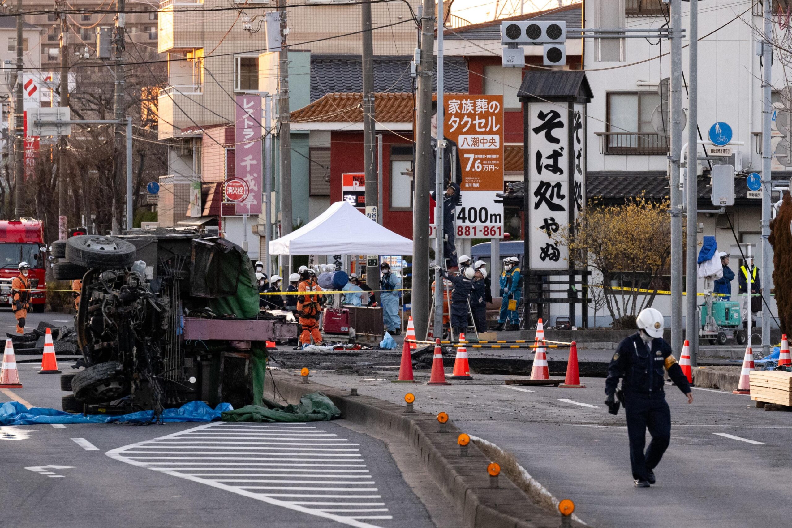 truck driver, collapse, Japan, Tokyo, Yashio, road collapse, sinkhole, rescue, sewer, infrastructure, urban decay, Fukuoka, accident, death, investigation
