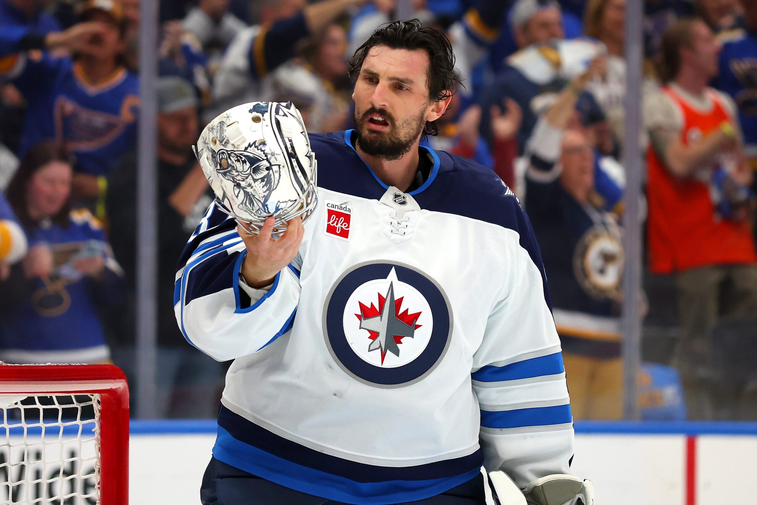 Connor Hellebuyck, Winnipeg Jets, NHL Playoffs, Vezina Trophy, Goalie Performance, Save Percentage, Goals Against Average, Scott Arniel, Eric Comrie, Goalie Controversy, Playoff Struggles, Hockey Analysis
