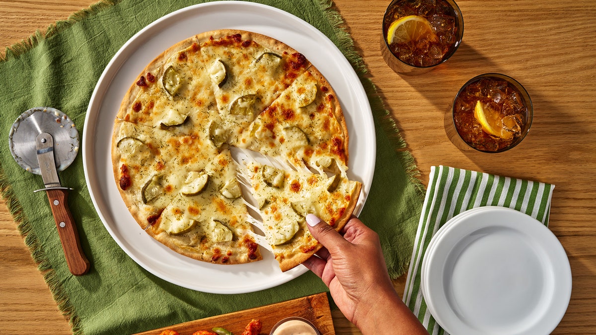 dill pickle pizza, California Pizza Kitchen, CPK, frozen pizza, Target, pickle pizza, food trends, new products, pizza toppings, controversial toppings, culinary trends, pickle craze, Good & Gather, Caulipower, pizza review
