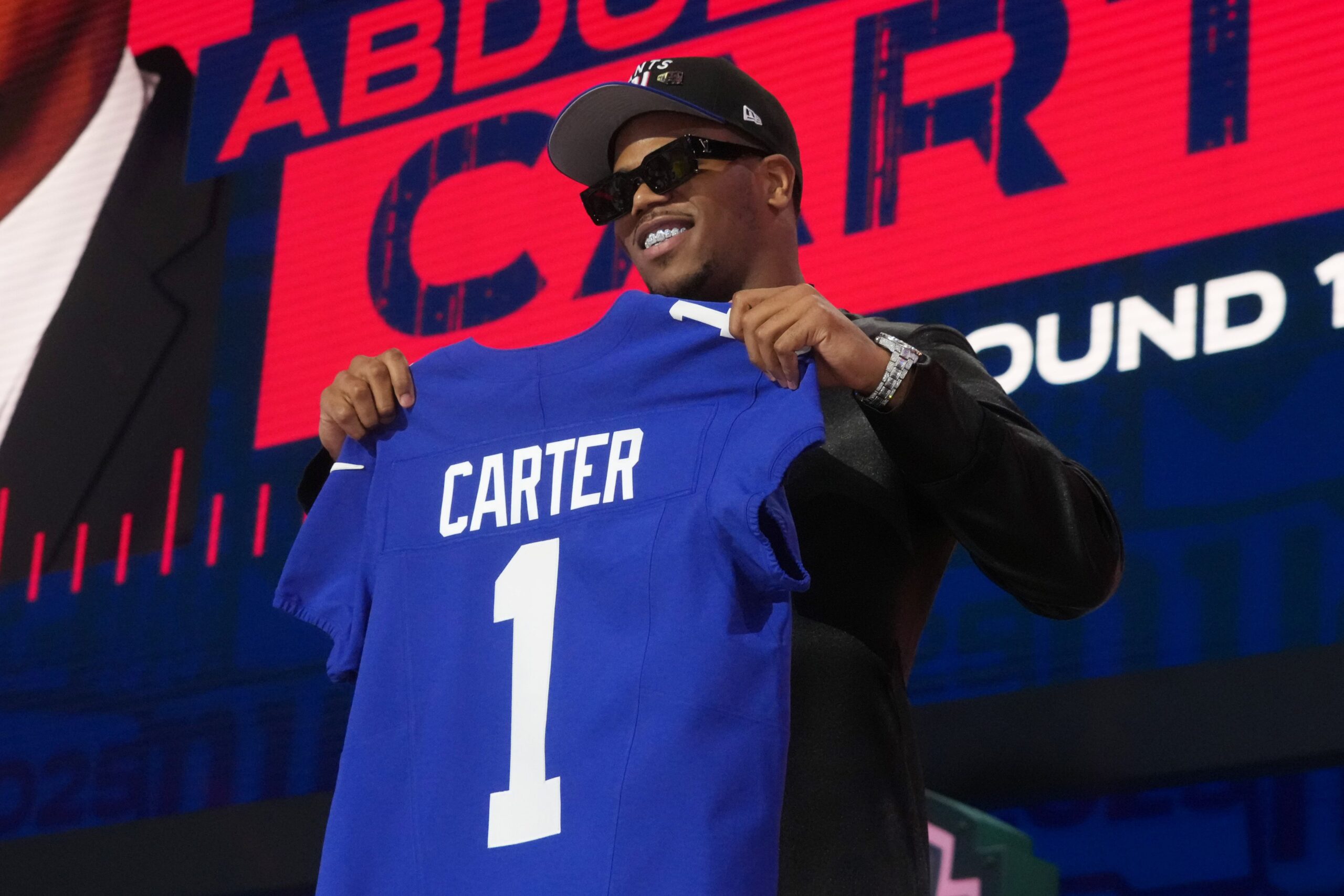 Abdul Carter, New York Giants, jersey number, Phil Simms, Lawrence Taylor, NFL Draft, retired jersey, Gary Myers, NFL, football
