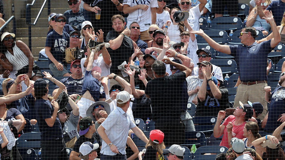 Yankees, Rays, baseball, MLB, foul ball, catch, dad, father, daughter, fan, Jeff Nelson, Aaron Judge, sports, New York Yankees, Tampa Bay Rays, YES Network, viral video, miraculous catch, dad reflexes
