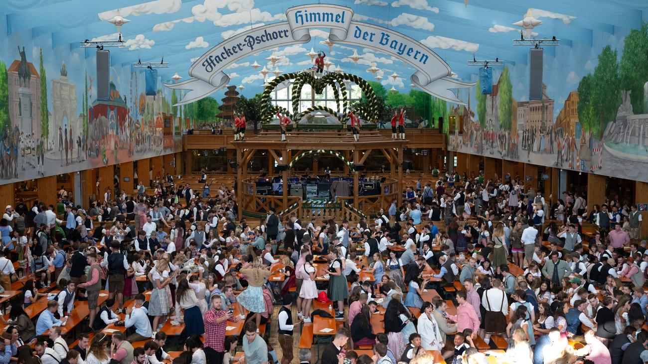 Oktoberfest, Munich, Wiesn, Beer festival, Reservations, Local residents, Tents, Food vendors, Oide Wiesn, Beppi Bachmaier, Herzkasperlzelt, Boandlkramerei, Music tent, Rain ponchos, Oktoberfest logo, Clemens Baumgärtner, Christian Scharpf
