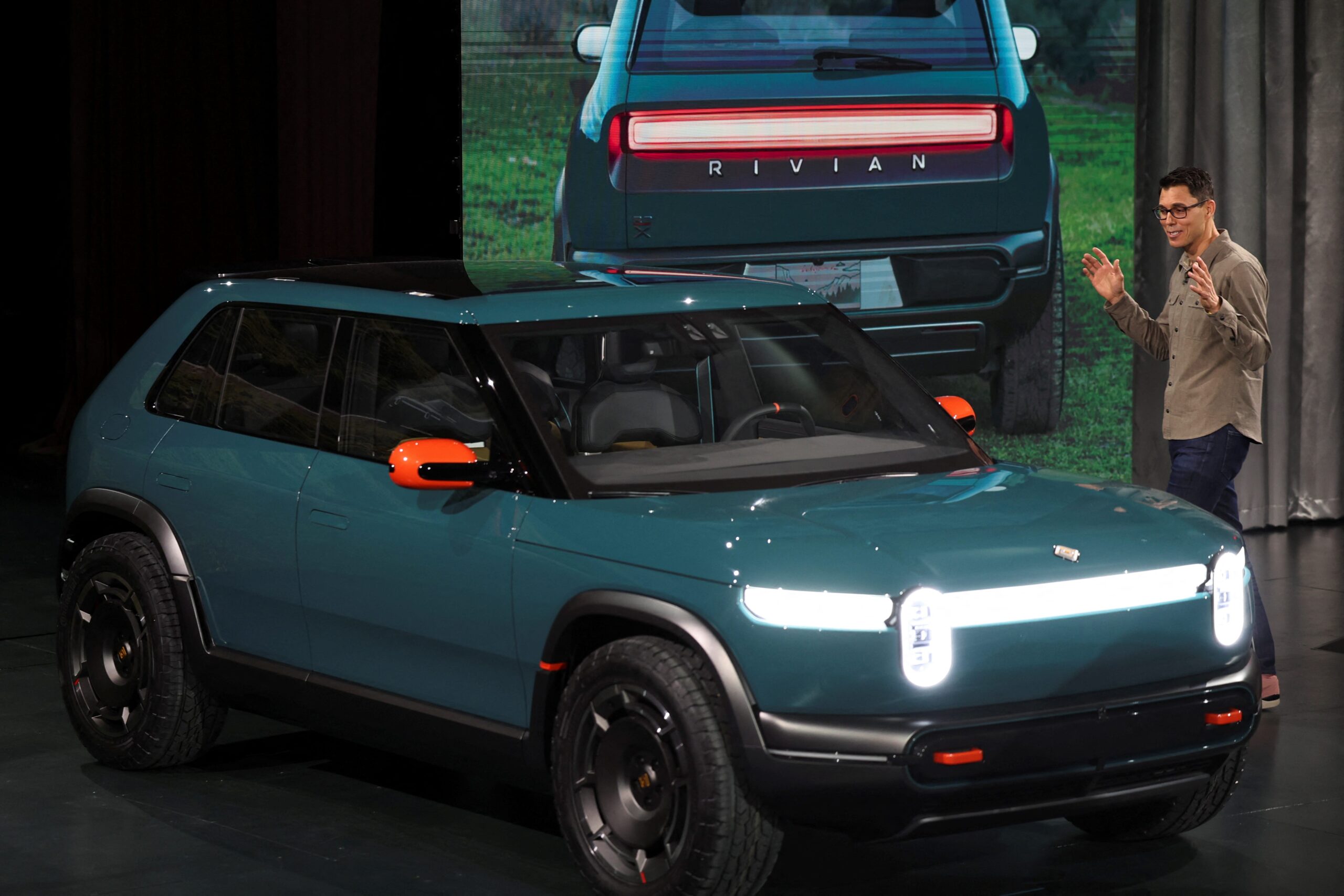 Rivian, RIVN, electric vehicle, EV, R2 SUV, supplier park, Illinois, Normal, manufacturing, production, R1S SUV, R1T pickup truck, commercial vans, RJ Scaringe, Georgia plant, R3 crossover, Q1 deliveries, Claire McDonough, auto tariffs, Donald Trump, supply chain, vehicle parts, investment, jobs, construction, underground tunnel
