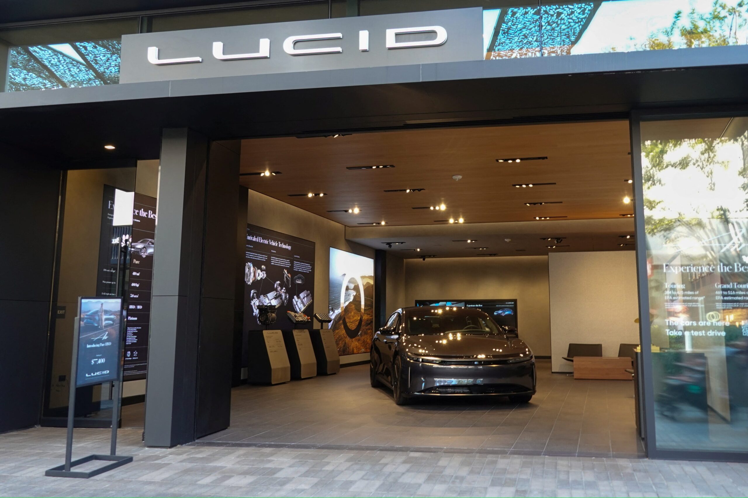 Rivian, RIVN, Lucid, LCID, electric vehicles, EV, tariffs, auto parts, imported vehicles, vehicle costs, RJ Scaringe, Marc Winterhoff, EV sales, production forecast, Tesla, TSLA, Volkswagen, VOWG_p.DE, R1S, R1T, Air sedan, Gravity SUV, Saudi Arabia, supply chain, cost mitigation, 2025 deliveries, vehicle production, affordable vehicles, capital expenditures, gross profit, plant expansion, economic uncertainty, hybrid vehicles
