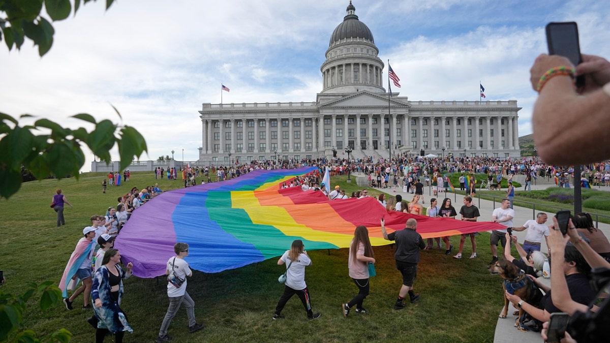 LGBTQ Pride flag, Salt Lake City, Boise, Utah, Idaho, flag laws, government buildings, Erin Mendenhall, Lauren McLean, political neutrality, flag ban, sego lily, Progress Pride flag, Transgender Pride flag, Juneteenth flag, Republican Gov. Spencer Cox, Republican House Speaker Mike Schultz
