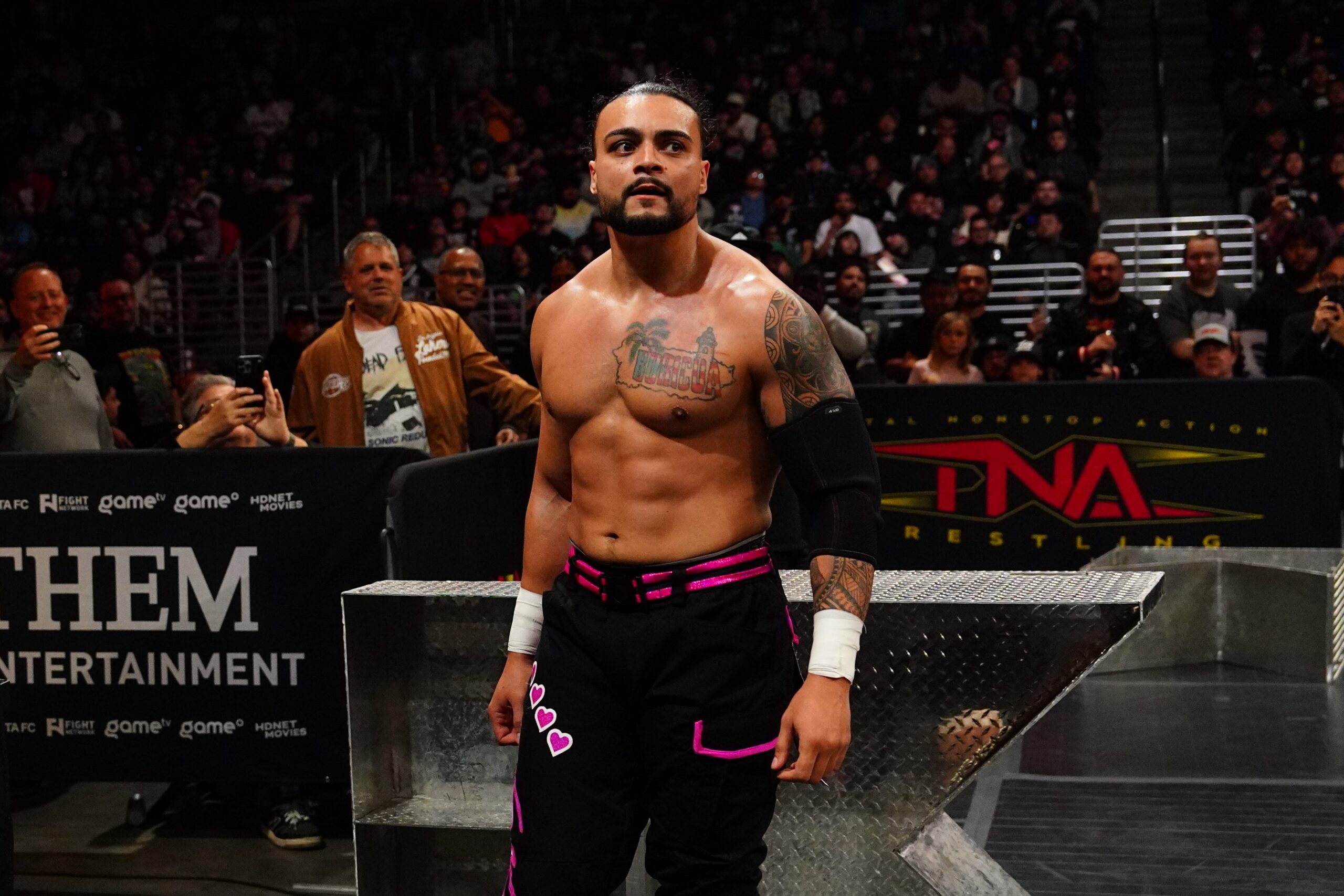 Mike Santana, TNA Wrestling, Mustafa Ali, Rebellion, falls count anywhere match, Ariana, father-daughter trip, Los Angeles, drug addiction, alcohol abuse, rehab, recovery, All Elite Wrestling, AEW, sobriety, TNA comeback, solo competitor, Moose, Frankie Kazarian, Josh Alexander, Bound for Glory, Turning Point, Genesis, I Quit match, Joe Hendry, TNA World Championship, WWE, main roster, inspiration, addiction recovery, wrestling promos, Griffith Park, Hollywood sign, Santa Monica Pier
