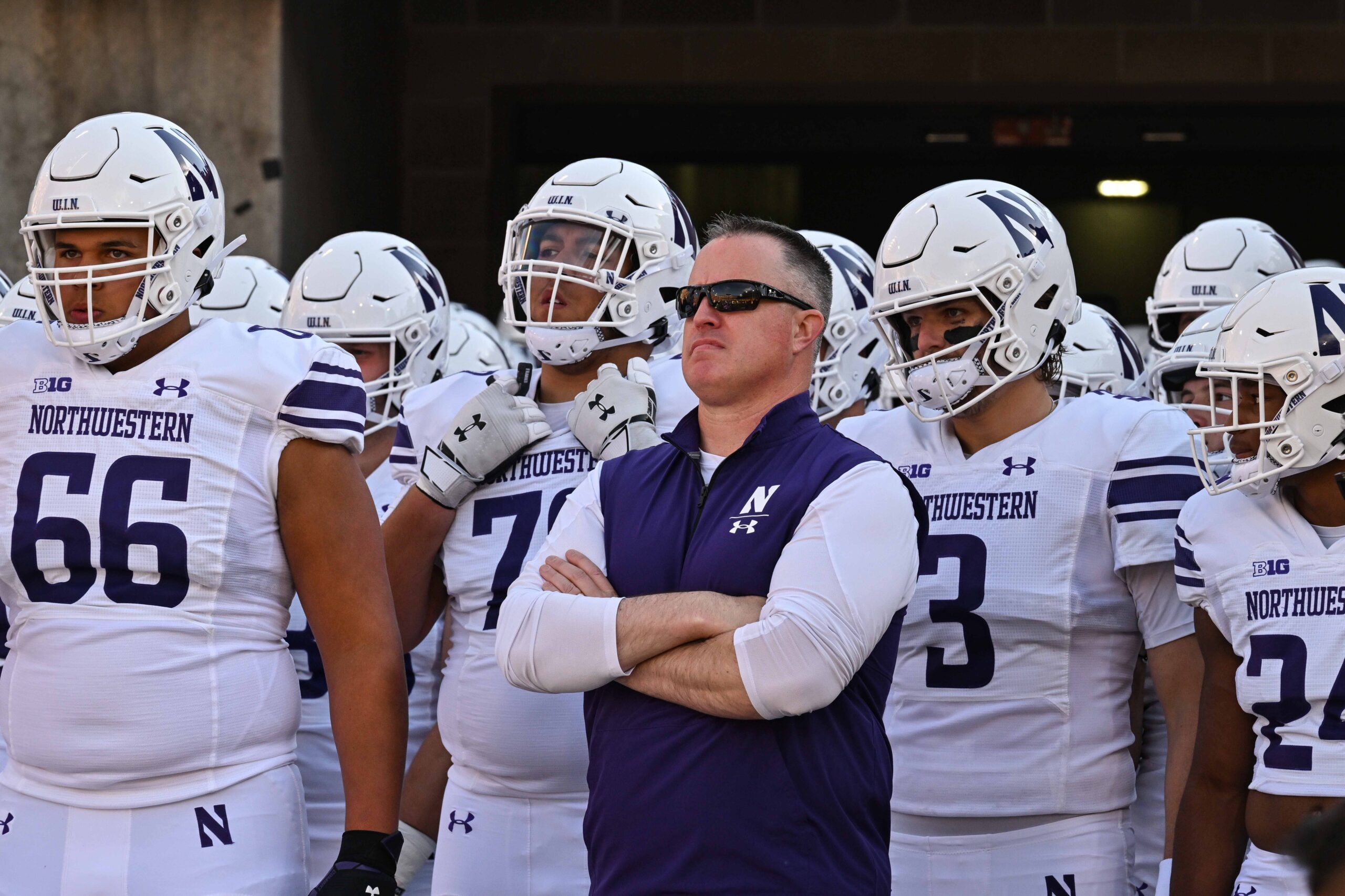 Northwestern University, hazing scandal, football, lawsuits, settlement, Pat Fitzgerald, wrongful termination, college sports, athlete abuse, sexualized acts, John Doe 1, Lloyd Yates, Wildcats, Cook County, Illinois, legal fight, settlement fund
