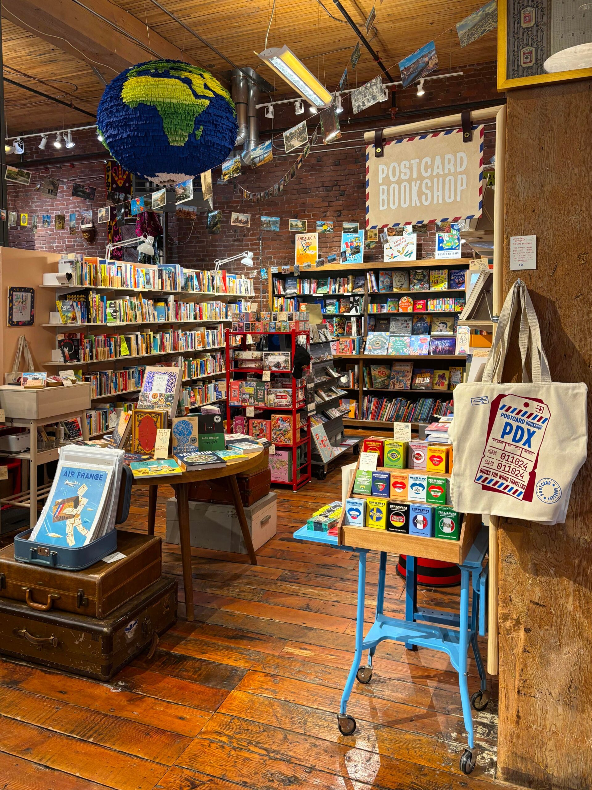 Independent bookstore, Portland Oregon, Postcard Bookshop, travel bookstore, book recommendations, Patrick Leonard, local bookstore, community, culture, literacy, education, diverse authors, reading, book club, CARGO Emporium, local artists, Dia de los Muertos, Robert MacFarlane, Peter Hessler, Hannah Kirshner
