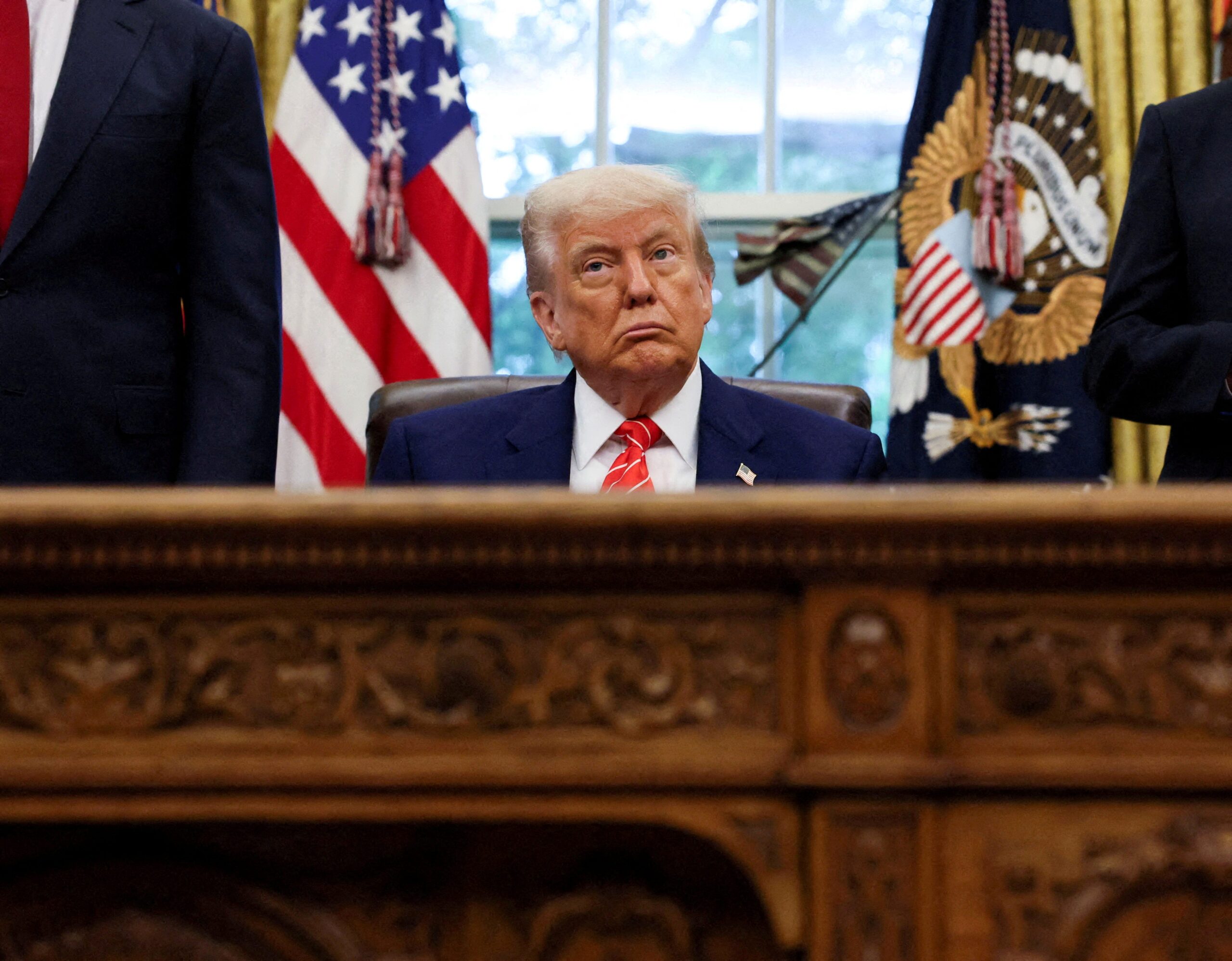 US auto industry, Donald Trump trade deal, UK auto imports, USMCA, General Motors, Ford, Stellantis, American Automotive Policy Council, Karoline Leavitt, trade war, tariffs, auto manufacturing, North American trade, international trade, auto industry concerns
