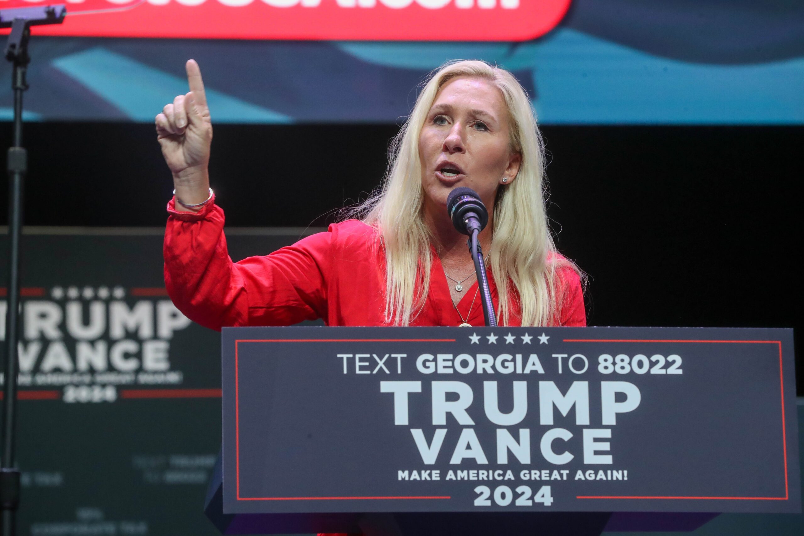 Marjorie Taylor Greene, Jon Ossoff, Georgia, Senate, 2024 midterms, Donald Trump, MAGA, Republican Party, election, political elites, conservative, divisive, campaign, White House, political consultants
