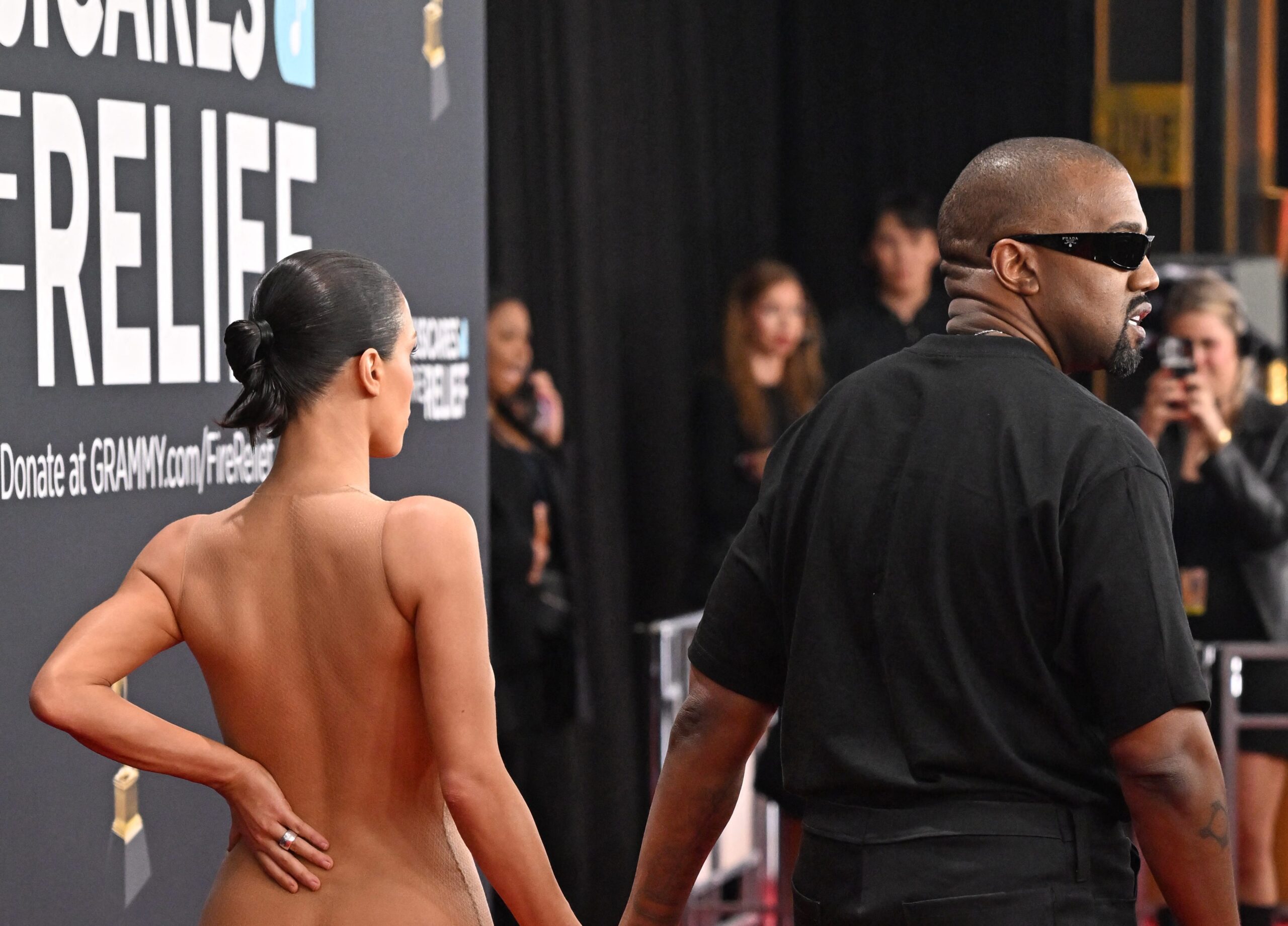 Cannes Film Festival dress code, nudity ban, red carpet fashion, Bianca Censori, Kanye West, Ye, Grammys, see-through dress, revealing fashion, fashion trends, Lorynn Divita, fashion forecasting, sexual empowerment, objectification, Rose McGowan, MTV Video Music Awards, Harvey Weinstein, #MeToo movement, Shira Tarrant, pornography, power dynamics, Gen Z fashion, milkmaid dresses, club attire, Kendall Jenner, Coachella, skinny jeans, flared pants, baggy pants, fashion cycle, fashion industry, fashion trends over time
