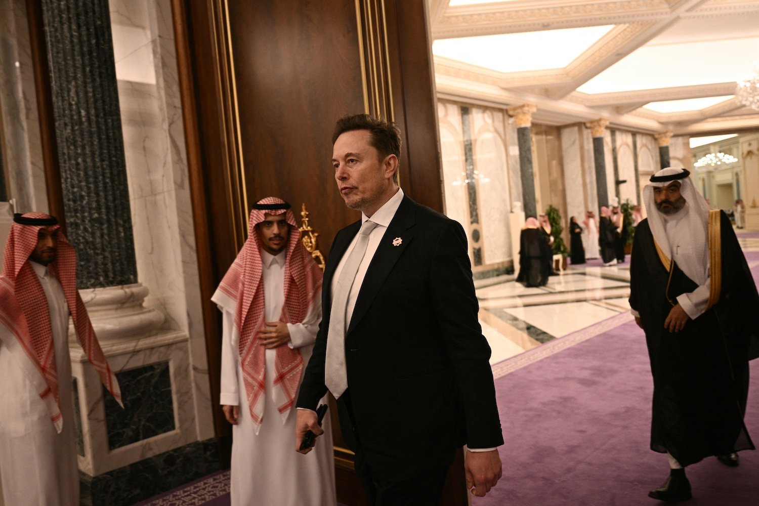 Elon Musk, Starlink, Saudi Arabia, SpaceX, maritime, aviation, robotaxis, Tesla, The Boring Company, Hyperloop, Loop, Trump, Saudi-U.S. Investment Forum, Mohammad bin Salman, MBS, Alex Karp, Larry Fink, Andy Jassy, Jensen Huang, Nvidia, AI chips, Tim Cook, Amazon, Oracle, AMD, Uber, Qualcomm, Johnson & Johnson, Sam Altman, OpenAI, C-3PO, R2-D2, humanoid robots, Lee Greenwood, God Bless the USA, Jamal Khashoggi, military equipment
