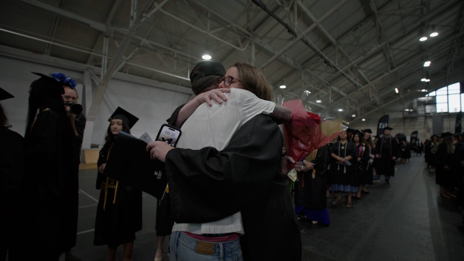 Graduating mom, soldier surprise, military homecoming, emotional reunion, Purdue Global graduation, nursing degree, mother and son, uplifting video, good news, Humankind, military family, surprise graduation, feel-good story, army specialist
